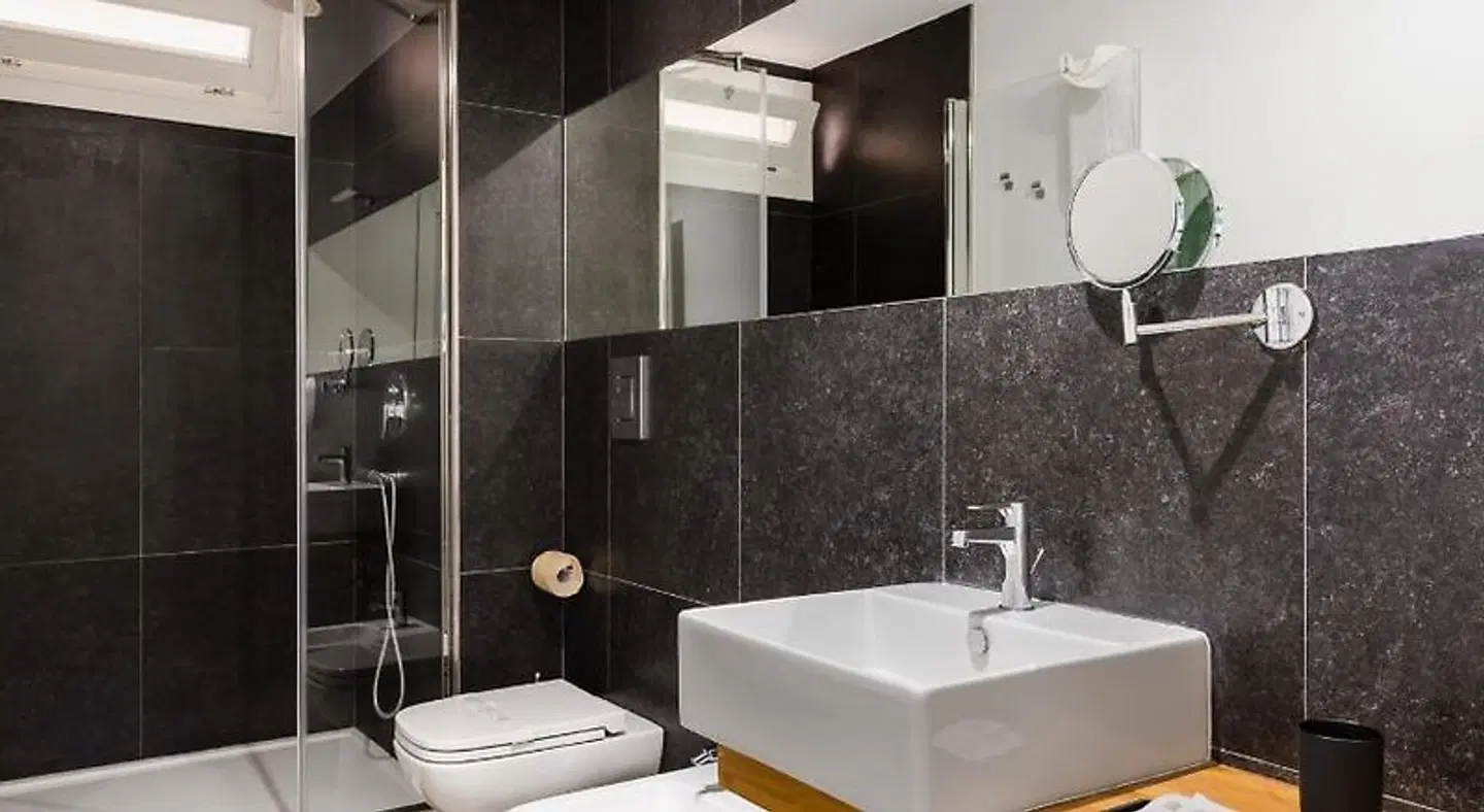 Archinuè Suite & Apartments Badezimmer