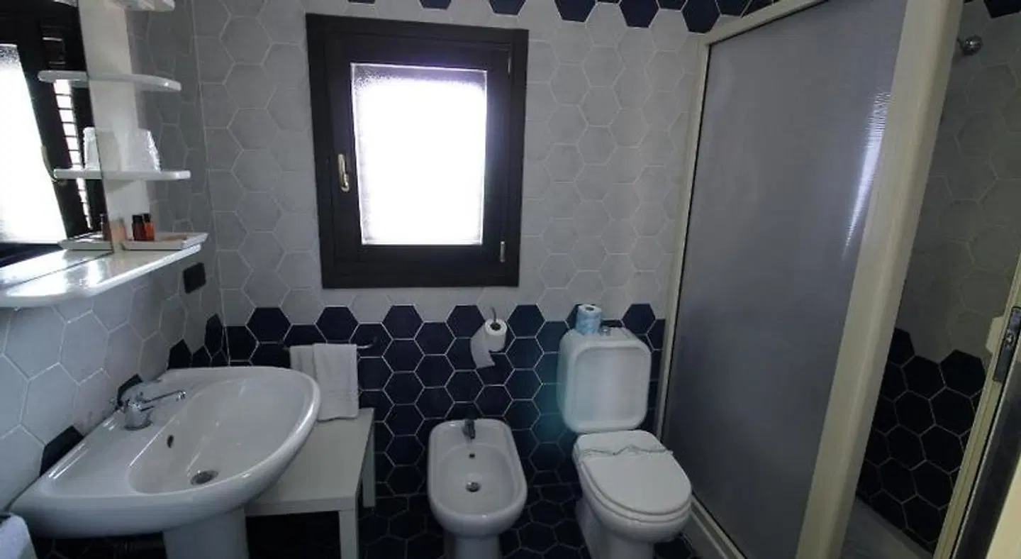 Hotel Capo Campolato Badezimmer