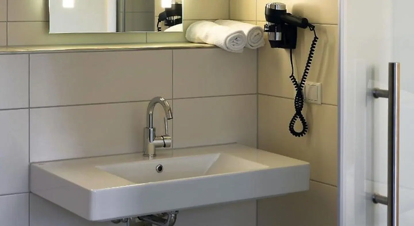 Hotel Velo Badezimmer