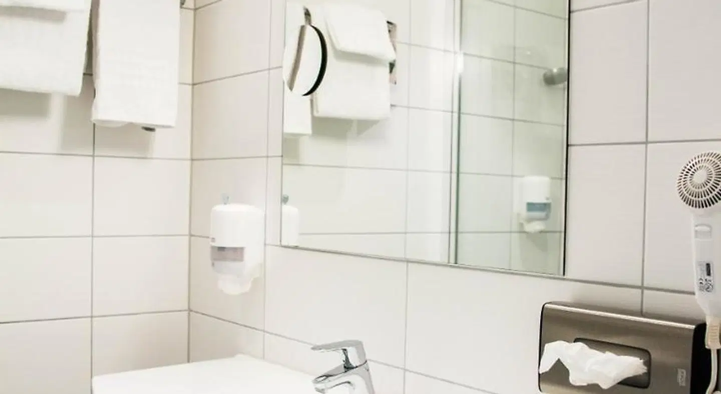 Quality Hotel Olavsgaard Badezimmer
