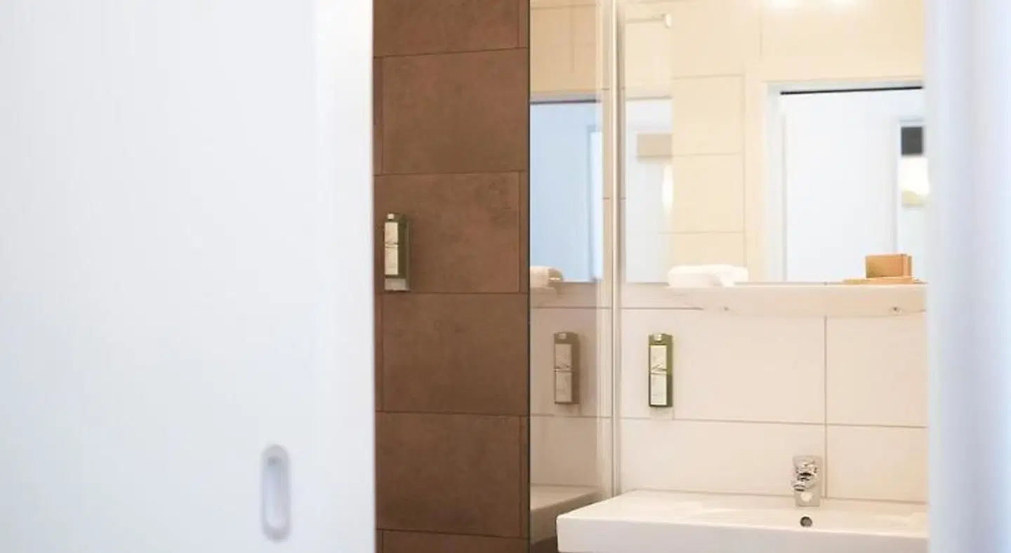 Centro Hotel U-NO1, Trademark Collection by Wyndham Badezimmer