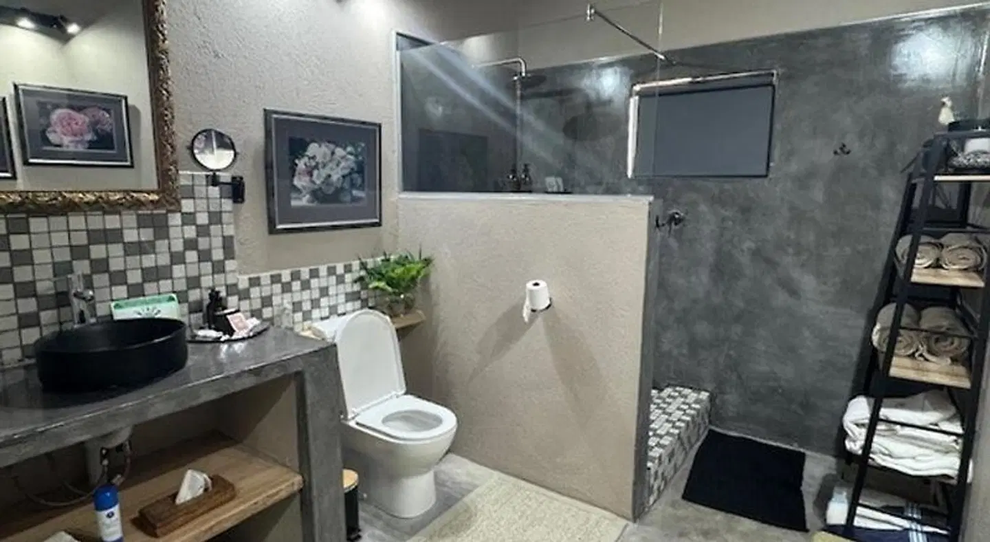 Plumbago Guest House Badezimmer