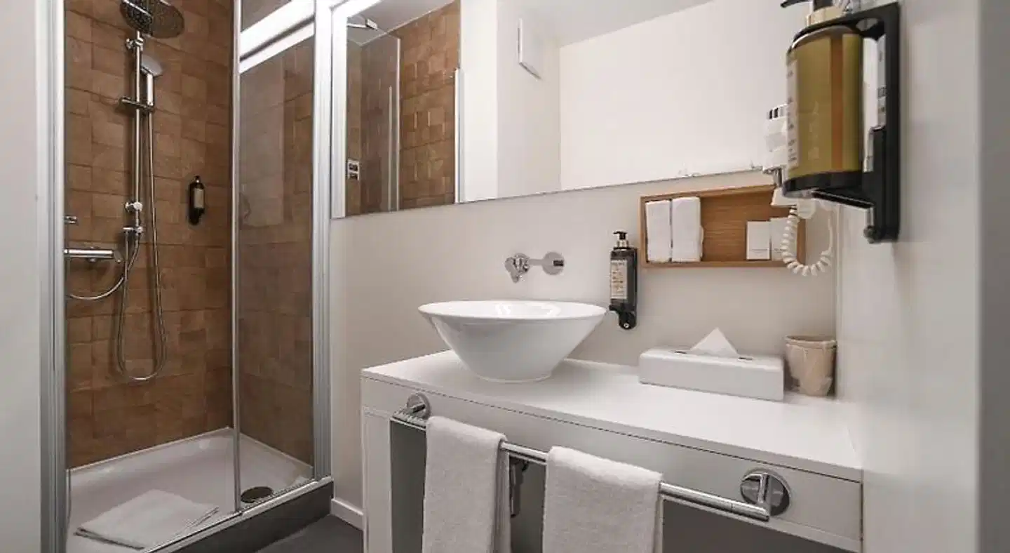 Home Swiss Hotel (ex Le Grenil) Badezimmer