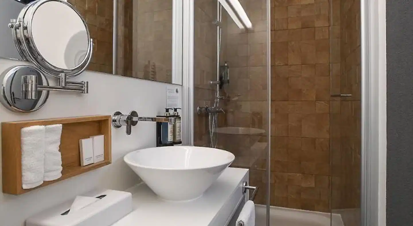 Home Swiss Hotel (ex Le Grenil) Badezimmer