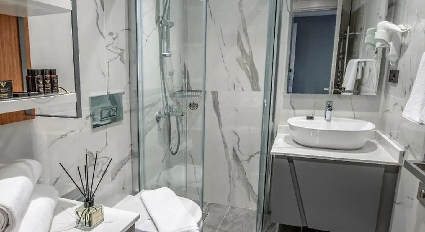 Valente Suites & Hotel Badezimmer