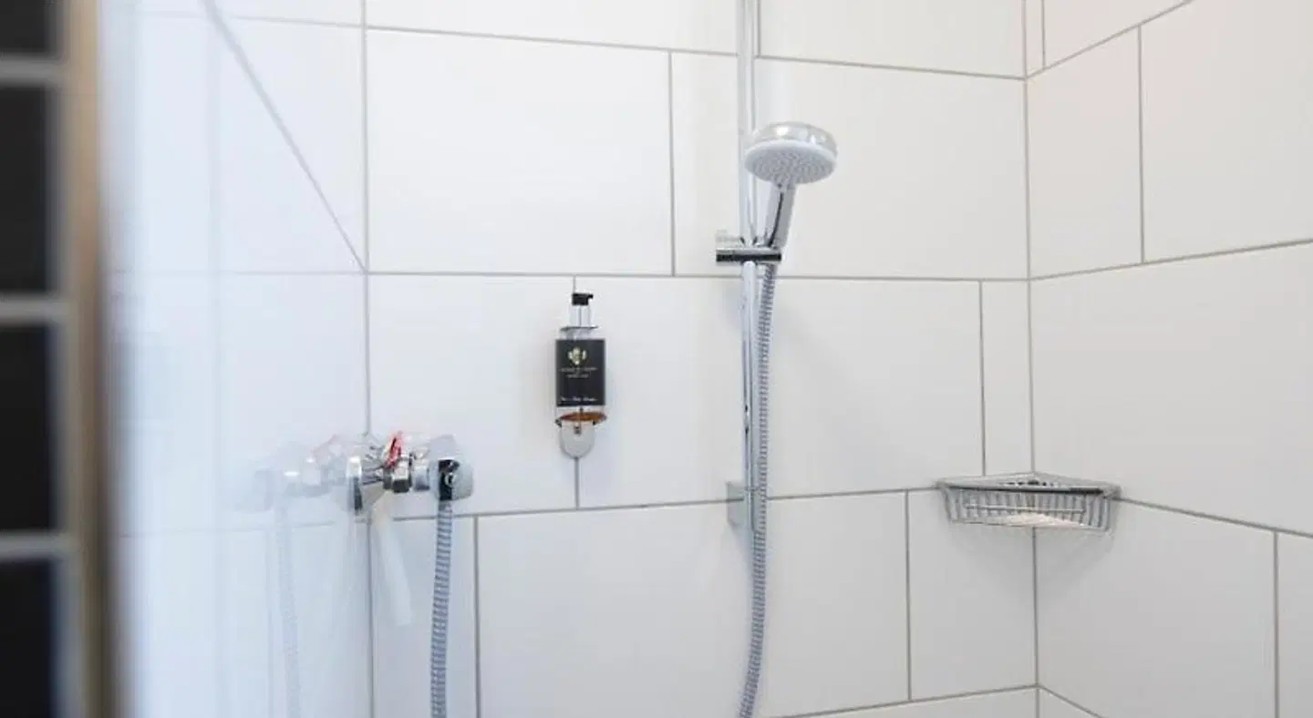 Smart & Stay Aparthotel Badezimmer