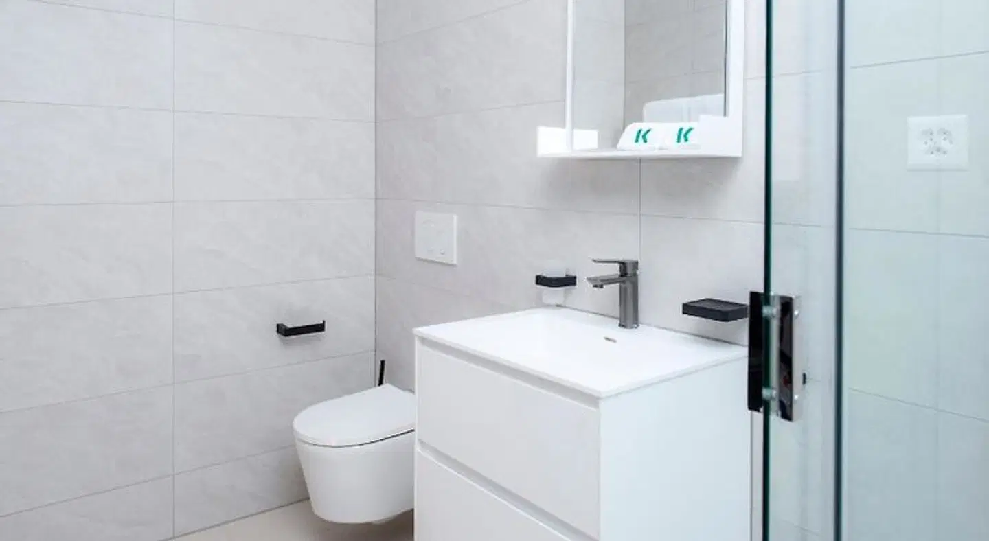 K BUSINESS Apartments & Hotel Badezimmer