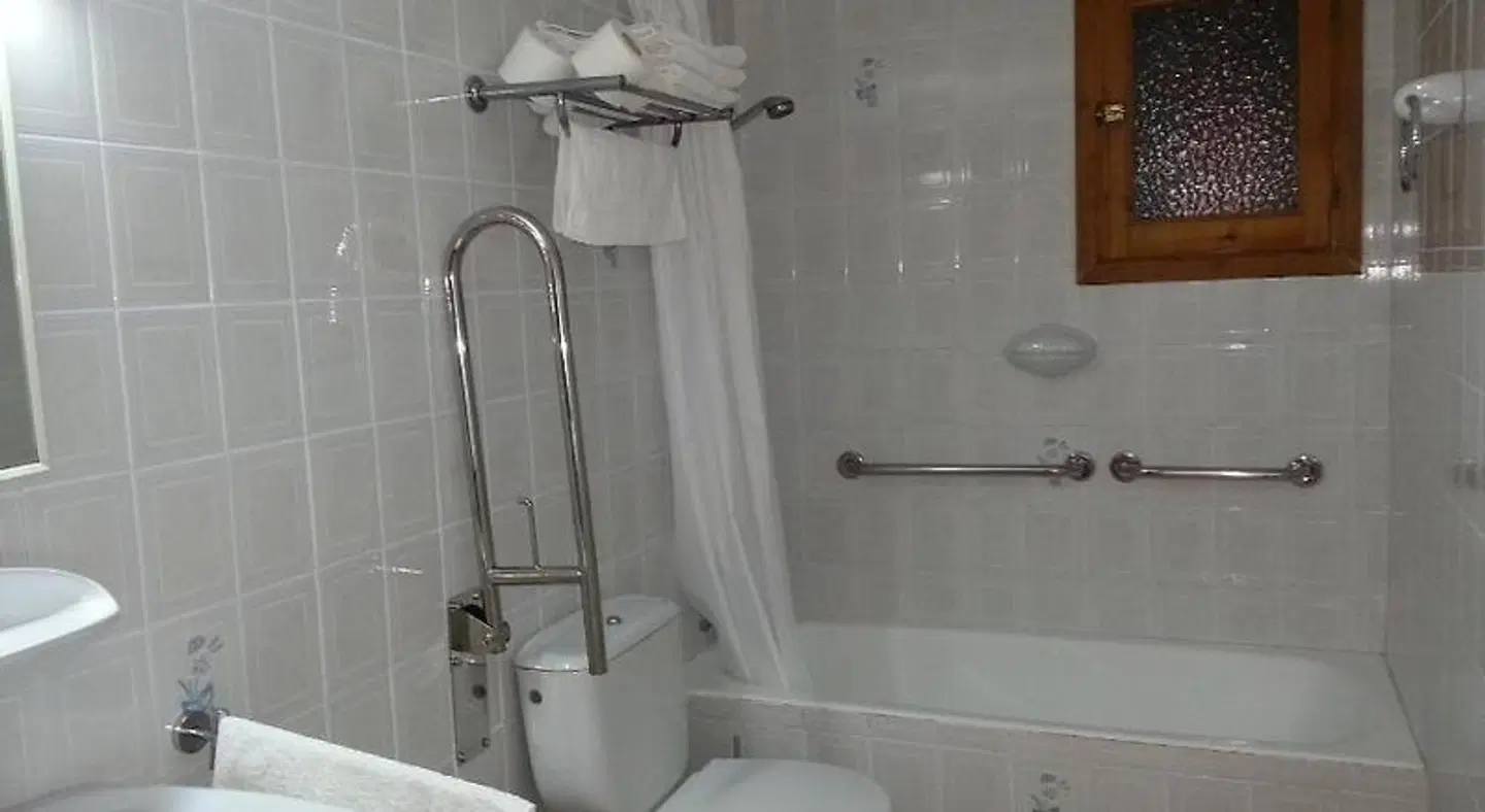 Apartamentos Vista al Puerto Badezimmer