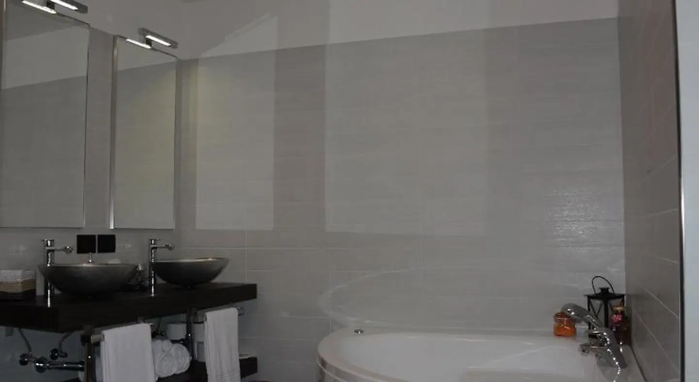 Hotel Alpino Badezimmer