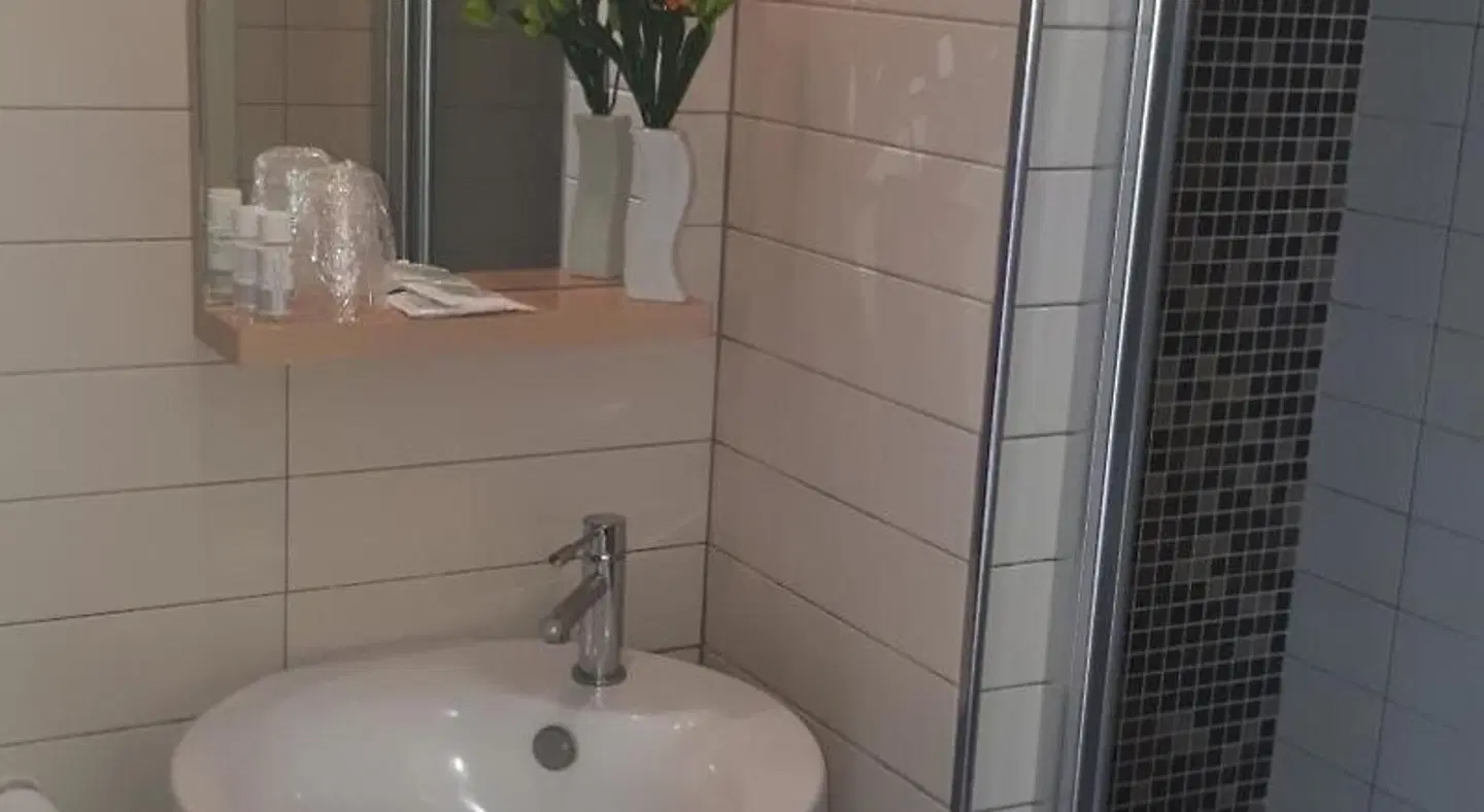 Seven Hostel & Rooms Badezimmer