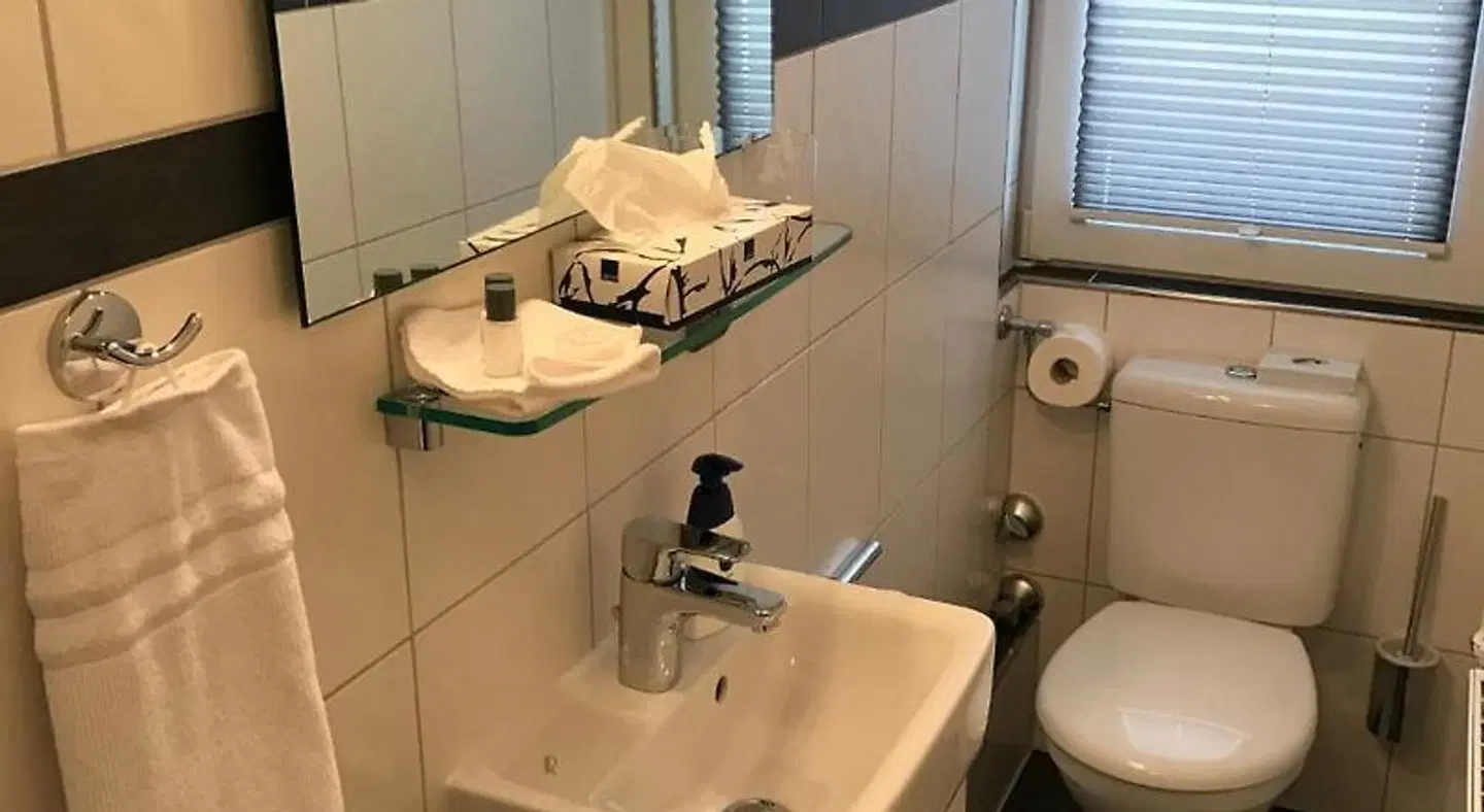 Hotel De Insulåner Badezimmer