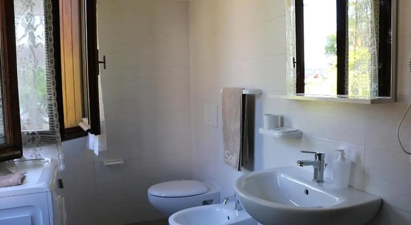 Appartamenti via Calnova Badezimmer